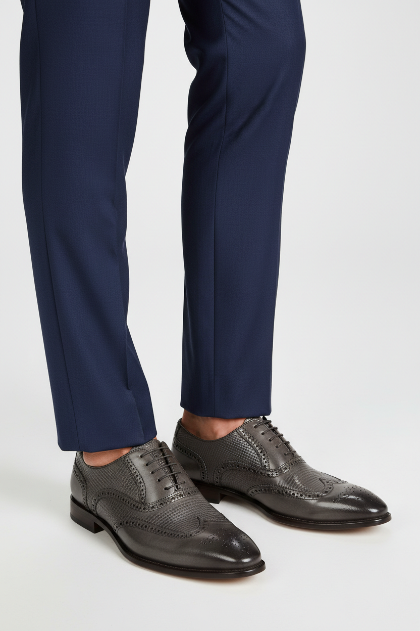 Male model wearing Giovanni Joel Green patterned leather brogue dress shoes with a charcoal suit