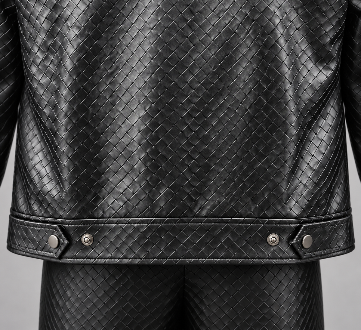Black Manzini Caribbean jacket rear hem snap tabs and basketweave detail