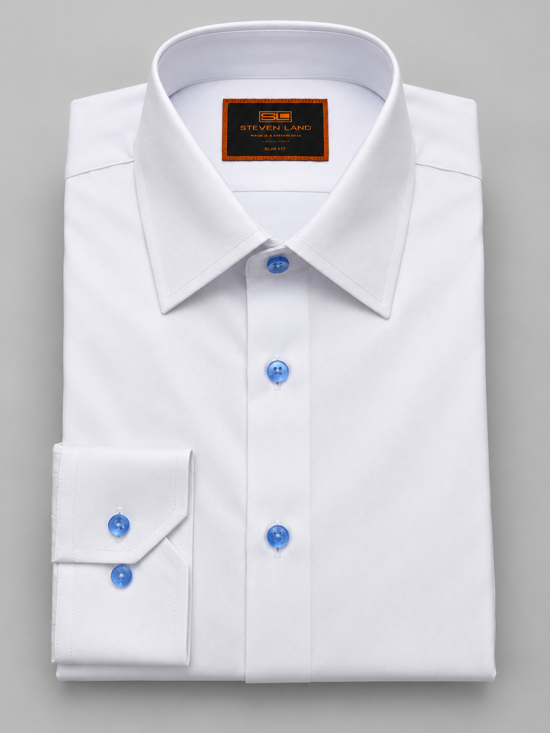 Steven Land DS467C white cotton dress shirt with light blue contrast buttons and button cuffs.