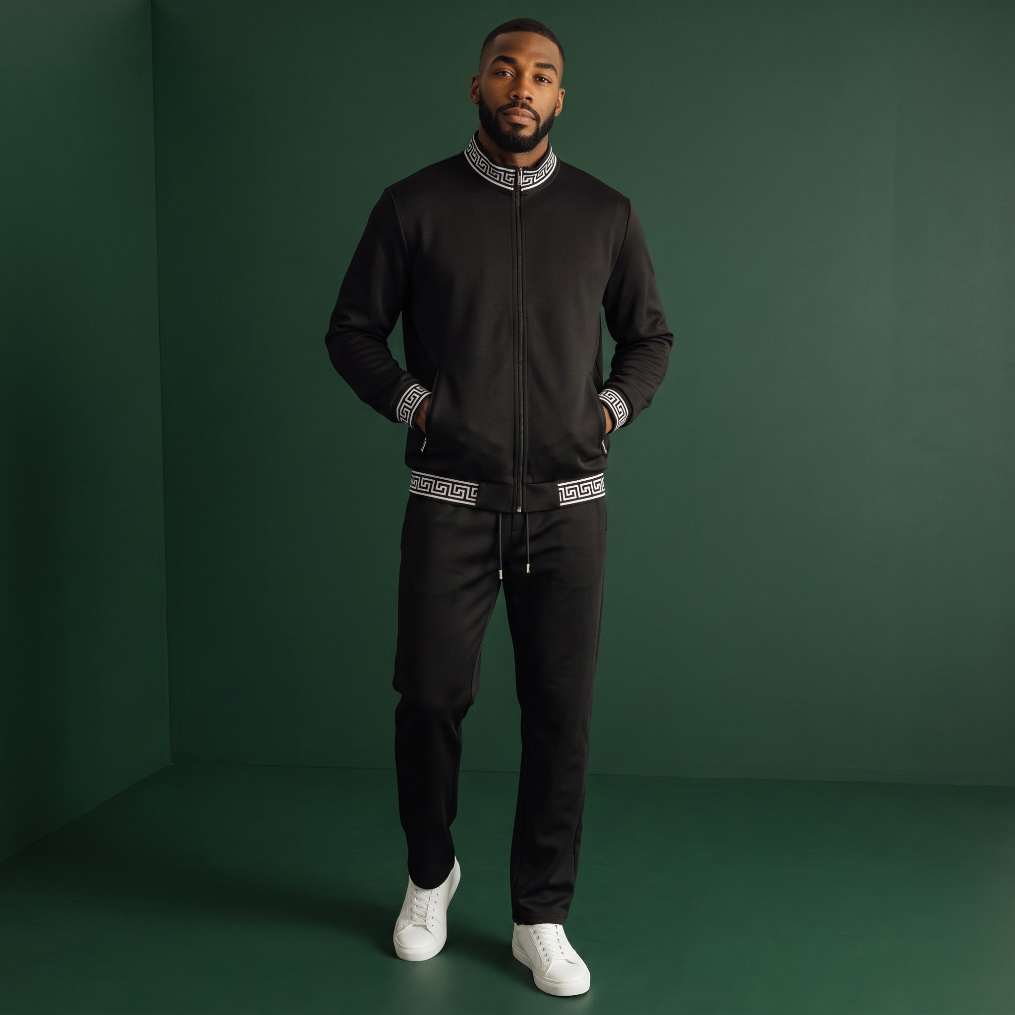 Model wearing The City Warehouse-Menswear black lounge set with white Greek key trim on jacket and jogger pants