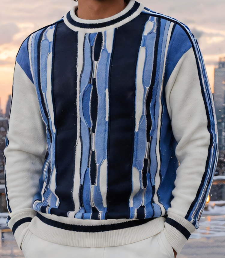 Front panel and sleeve detail of the Silversilk 32028 Navy sweater, showing contrasting blue and ivory patterns, striped sleeve trim and ribbed cuffs and hem.