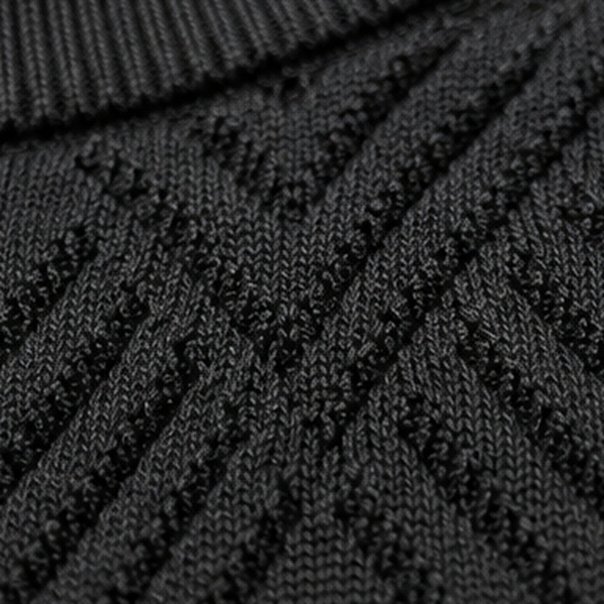 Detailed view of T.R black mockneck sweater TRCK-11558 raised chevron-and-diamond knit texture