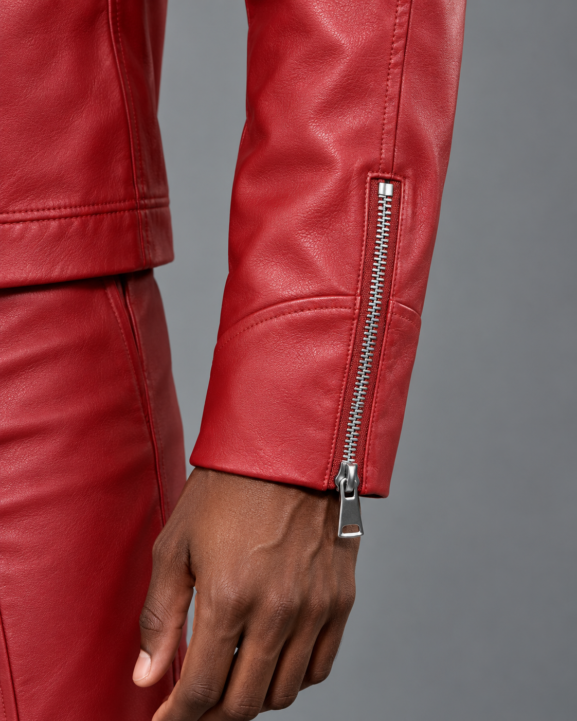 Giovanni Testi wine faux leather suit sleeve close-up with silver zipper cuff