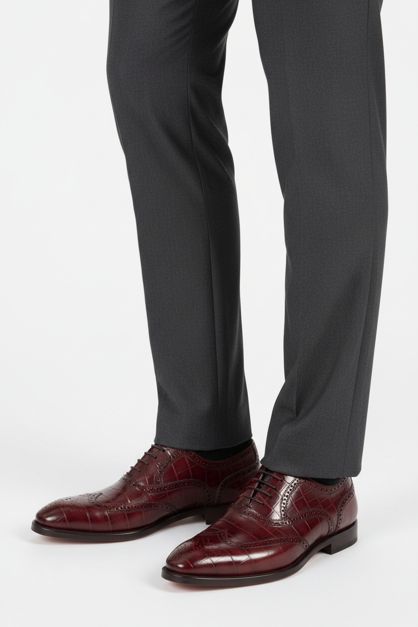 Man wearing burgundy croco-embossed Carrucci KS515-35 lace-up Oxford dress shoe with toe medallion