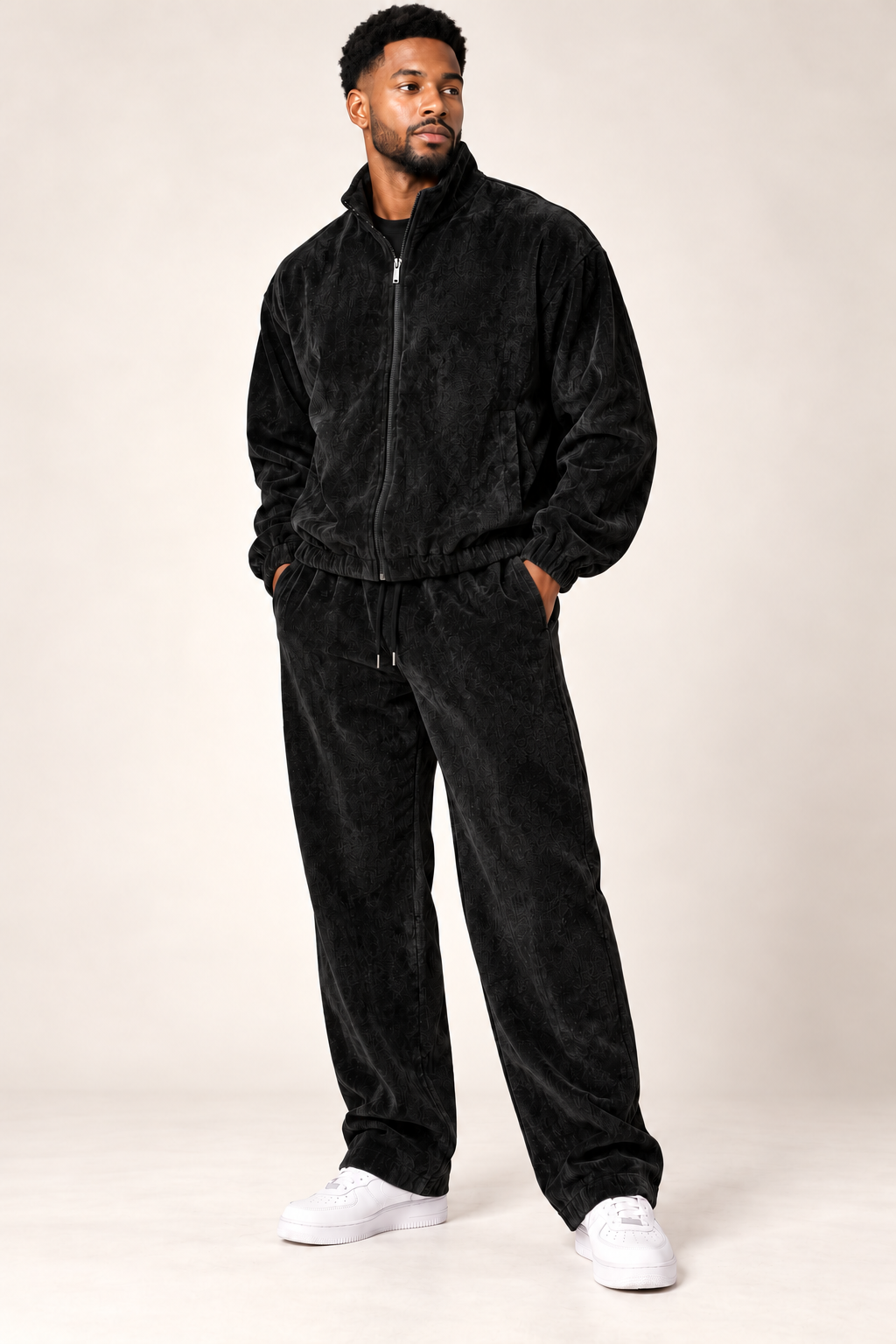 Insomnia Gold Label 2pc jogger set in deep Black modeled front three-quarter with tonal textured zip jacket and matching pants