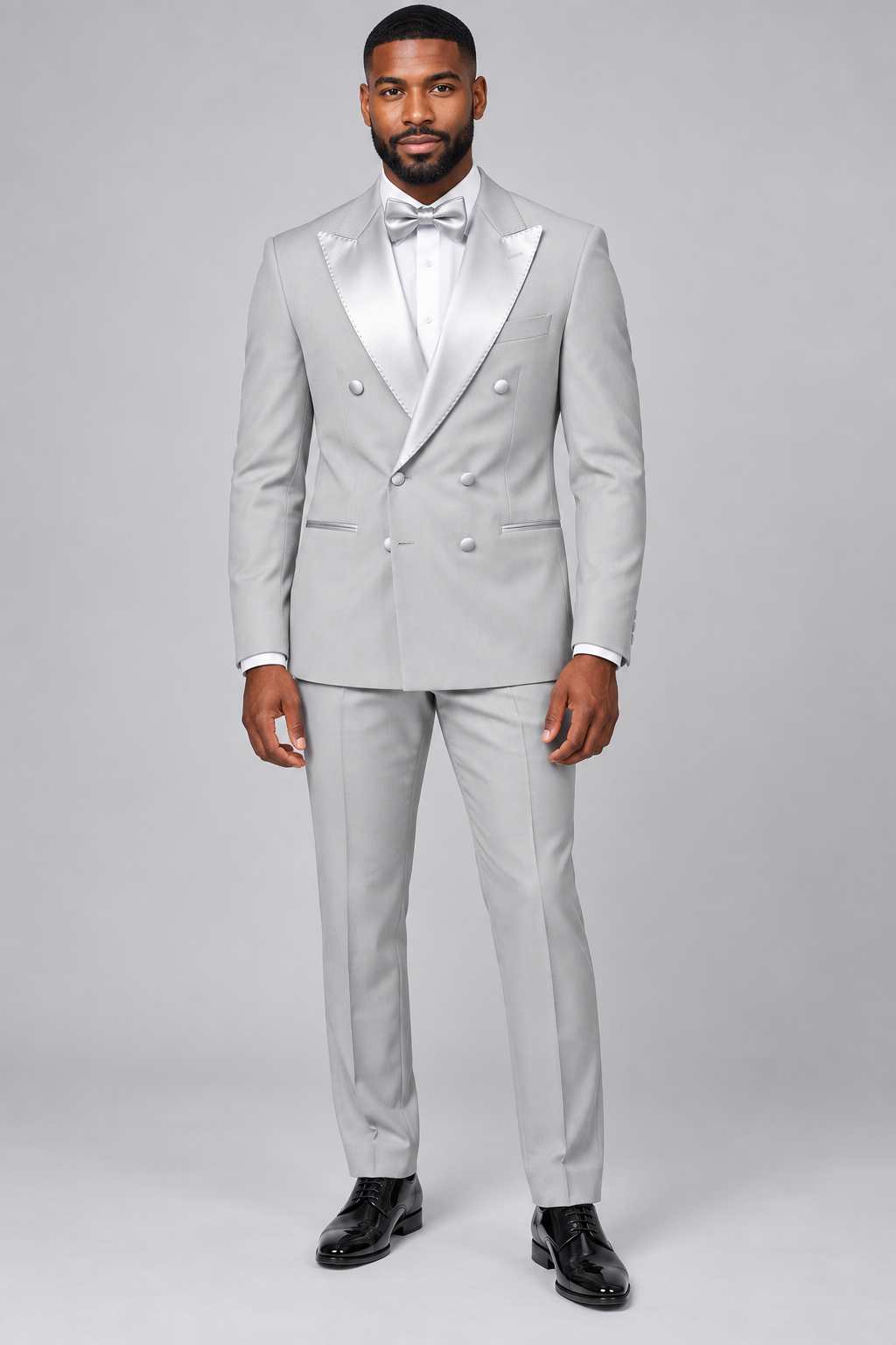 Marco Lorenzo 2542 silver slim fit double-breasted peak lapel tuxedo on model, full length with matching bow tie