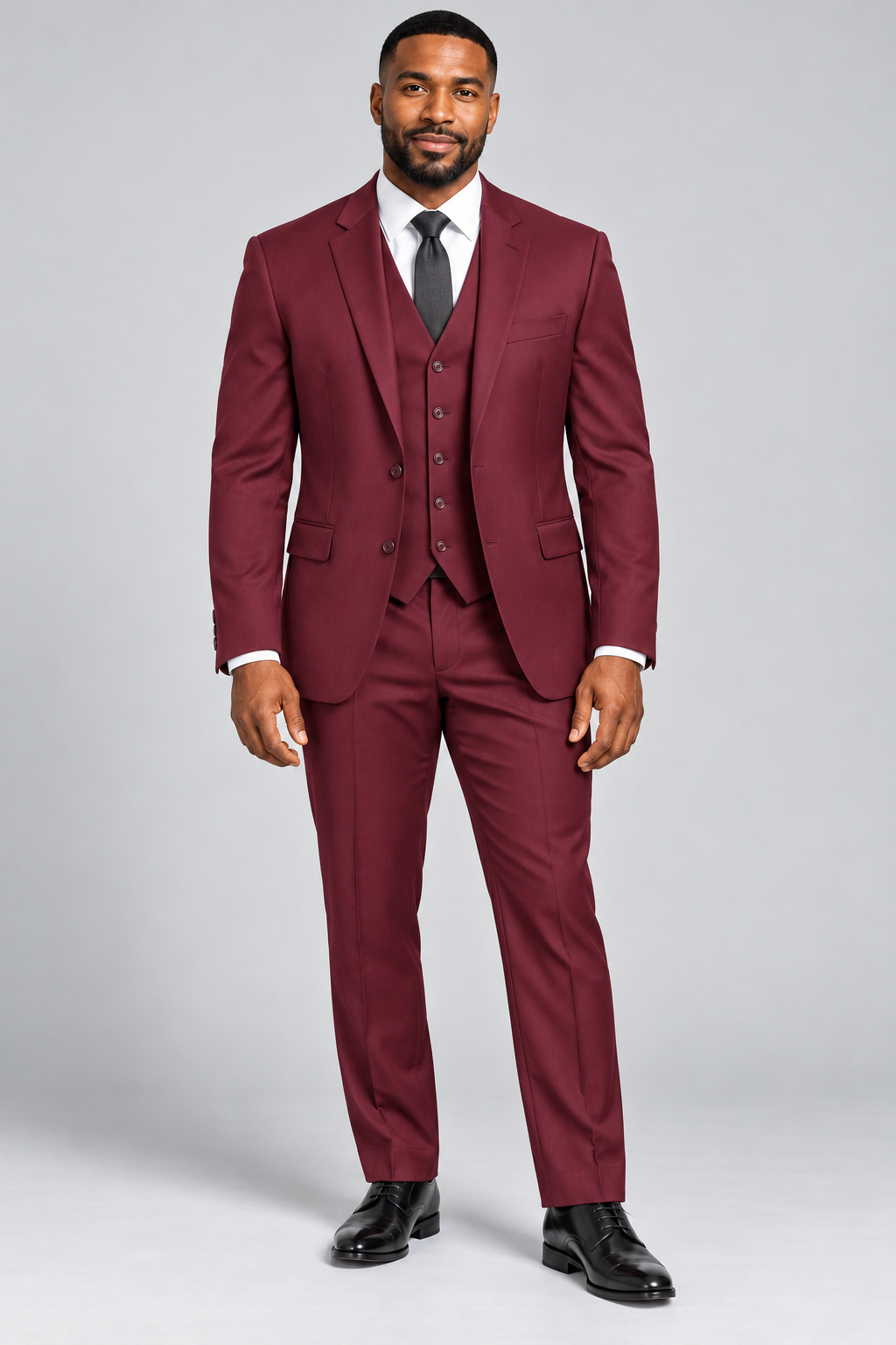 Model wearing the burgundy Pavaratti 203 modern-fit three-piece suit with matching jacket, vest and trousers