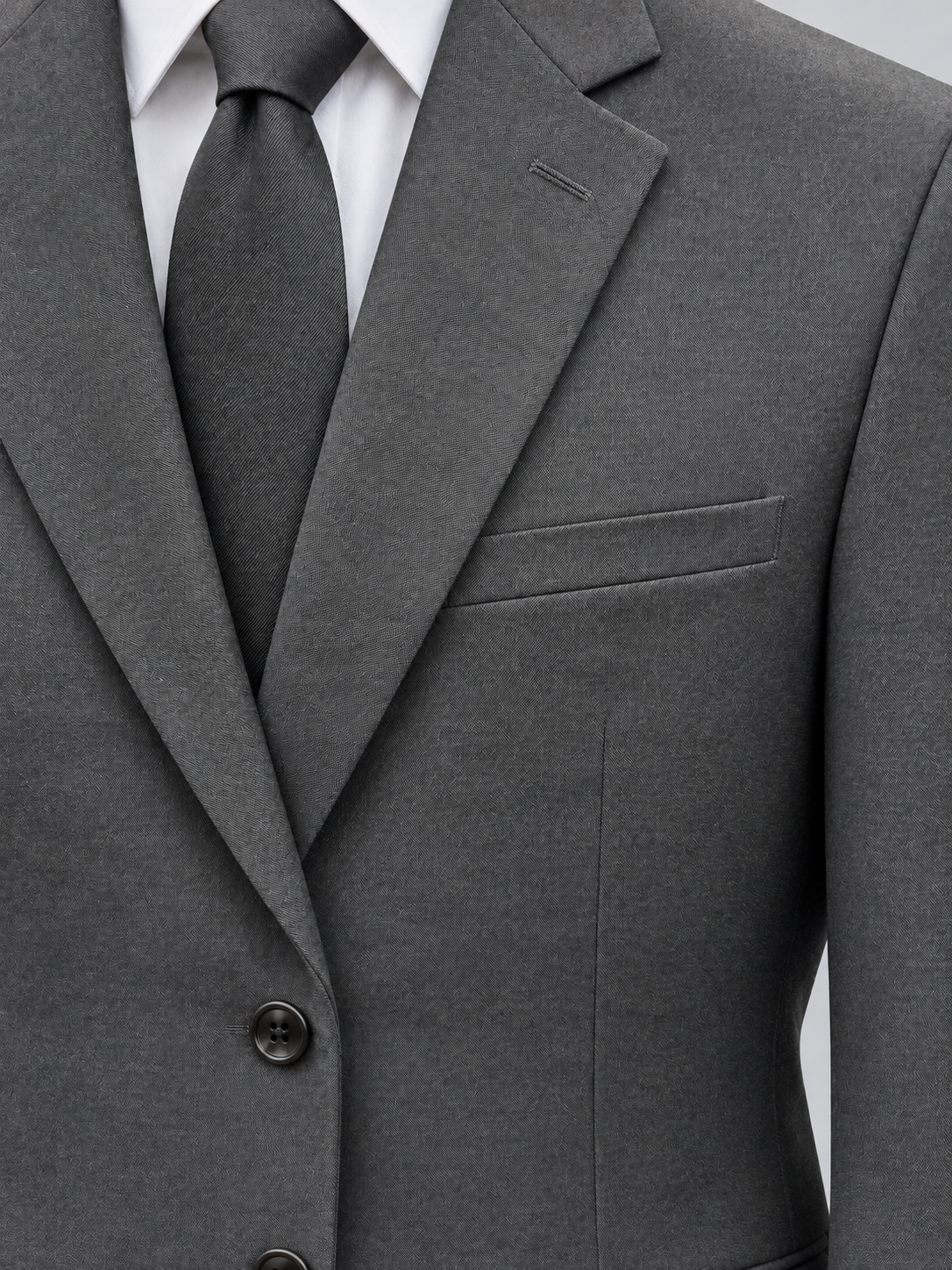 Close-up of the charcoal Pavaratti 203 modern-fit suit showing the notch lapel, chest pocket and fabric texture