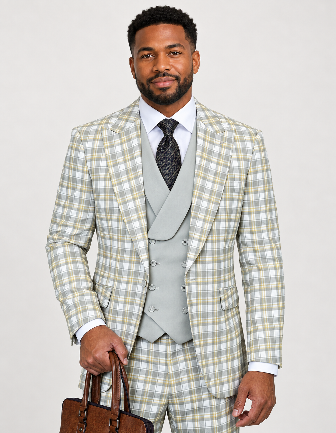 Saboo Terry tan plaid three-piece wool suit with matching trousers and a contrasting solid shawl-collar double-breasted vest, shown on a model