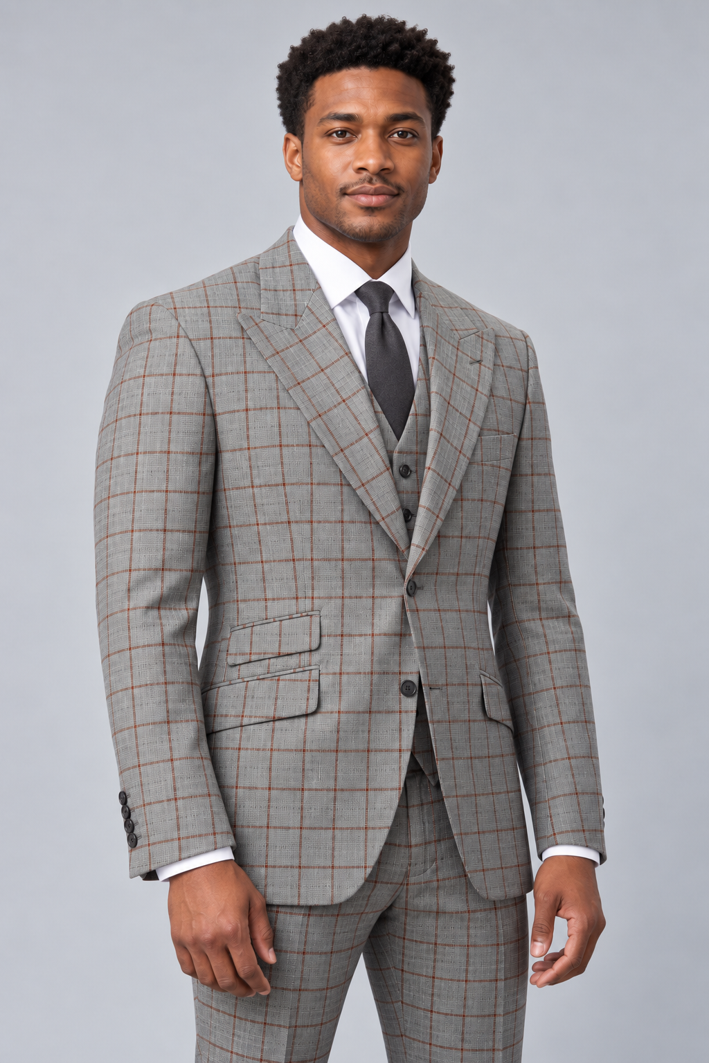 Saboo 1803 Gray three-piece modern-cut suit with subtle rust windowpane accents — three-quarter front view