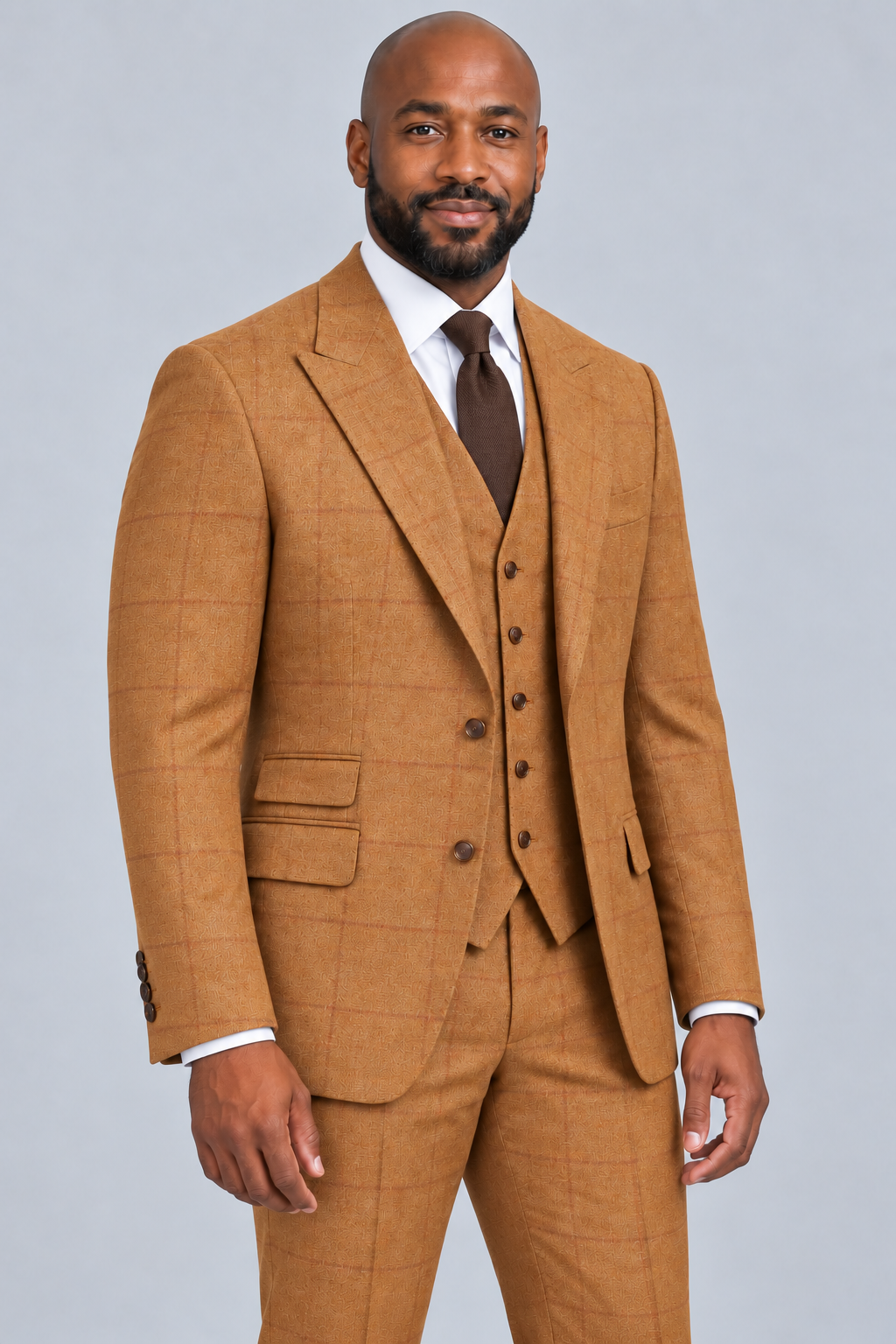 Saboo 2026 Rust three-piece modern-cut suit with subtle tonal windowpane — three-quarter front view