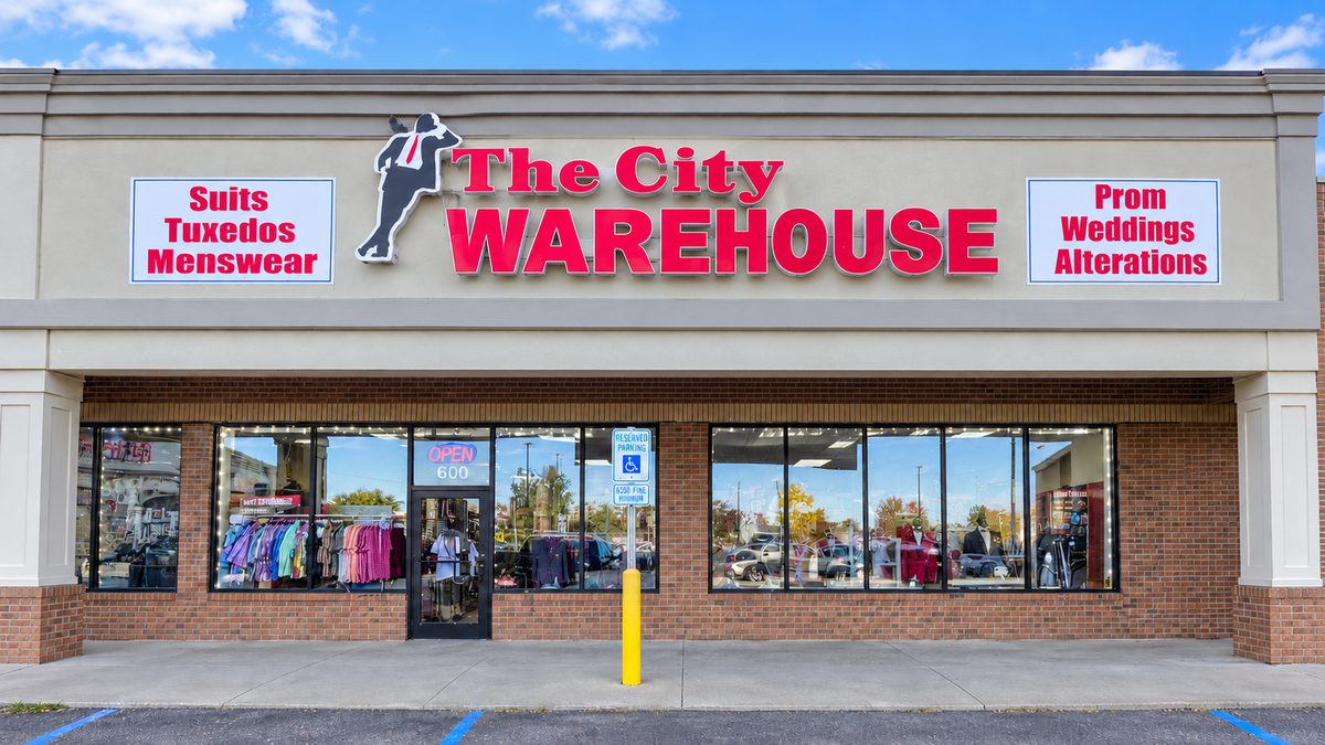 Retouched photograph of The City Warehouse Detroit storefront, with the temporary promotional banner removed