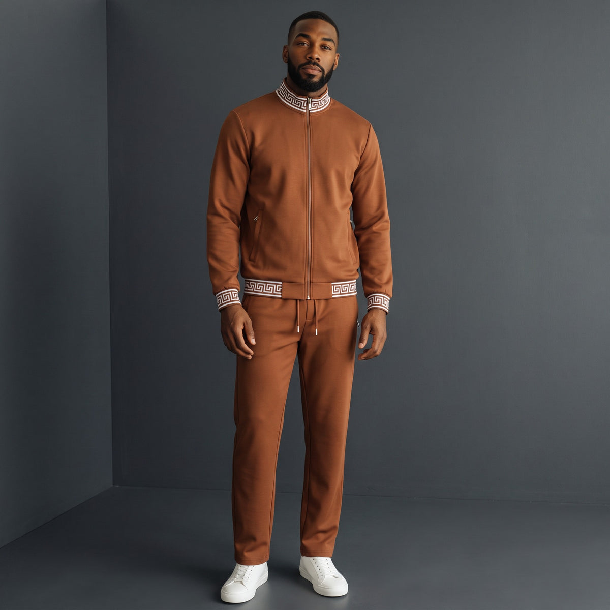 Model wearing a brown Barocco Imperial Trim Lounge Set with black and white Greek key detailing on collar and cuffs.